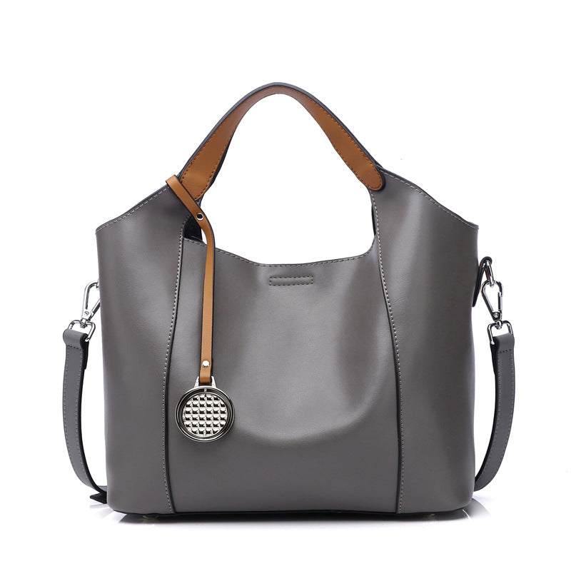 Elegant Leather Work Bag in gray with brown accents and versatile design for work or casual use.