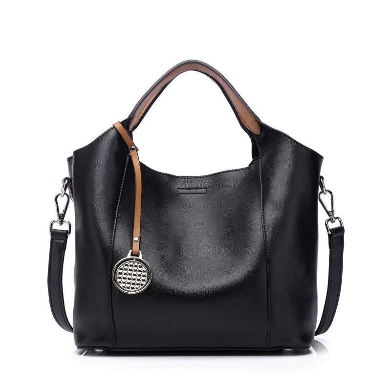 Black Leather Work Bag from Essence of Elegance Handbag Collection with versatile design and roomy interior.