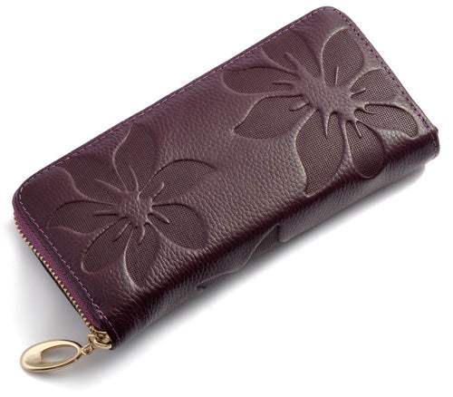 Ladies leather floral wallet in genuine leather with embossed floral design, featuring a gold zipper and compact design.