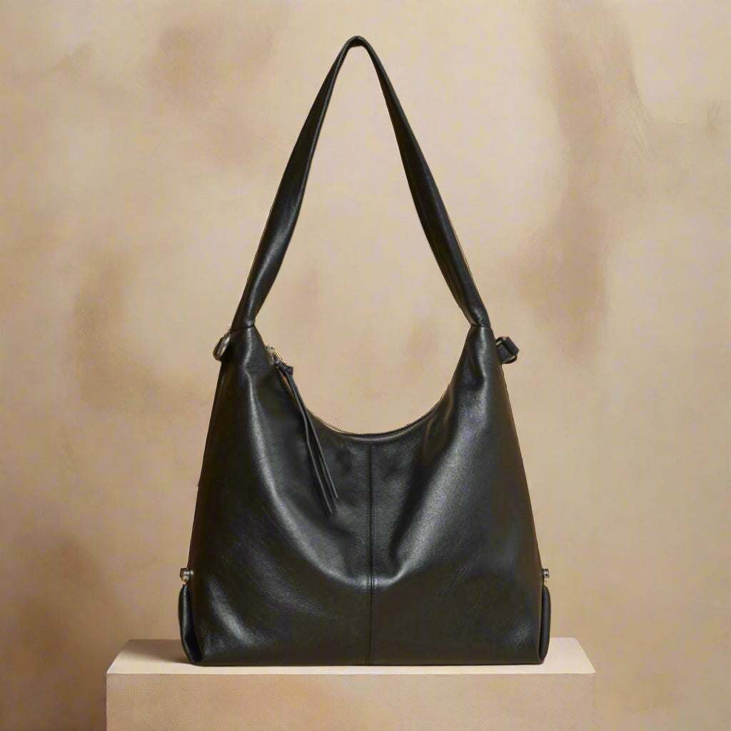Leather Hobo Shoulder Bag in black displayed on a neutral background, highlighting its sleek and elegant design.
