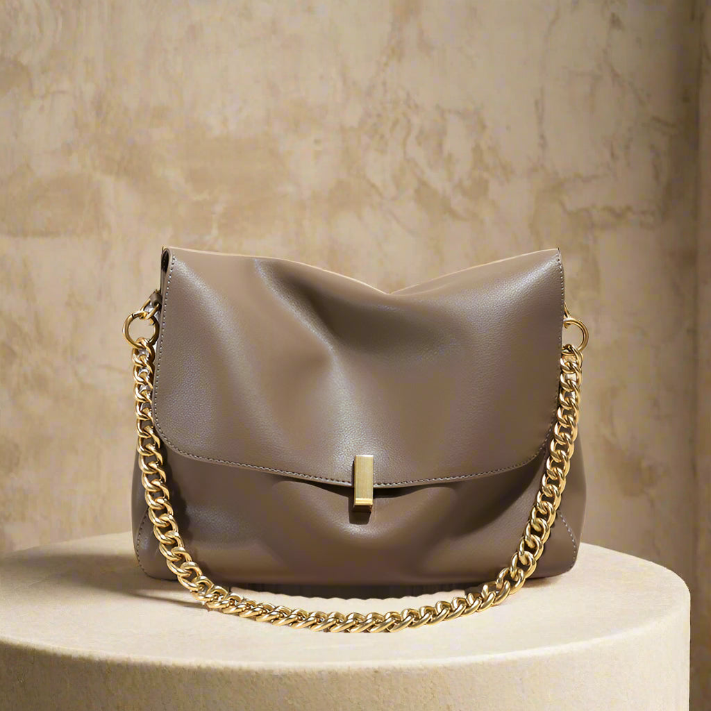 Genuine leather small messenger purse with chain strap, ideal for versatile styling and organization.