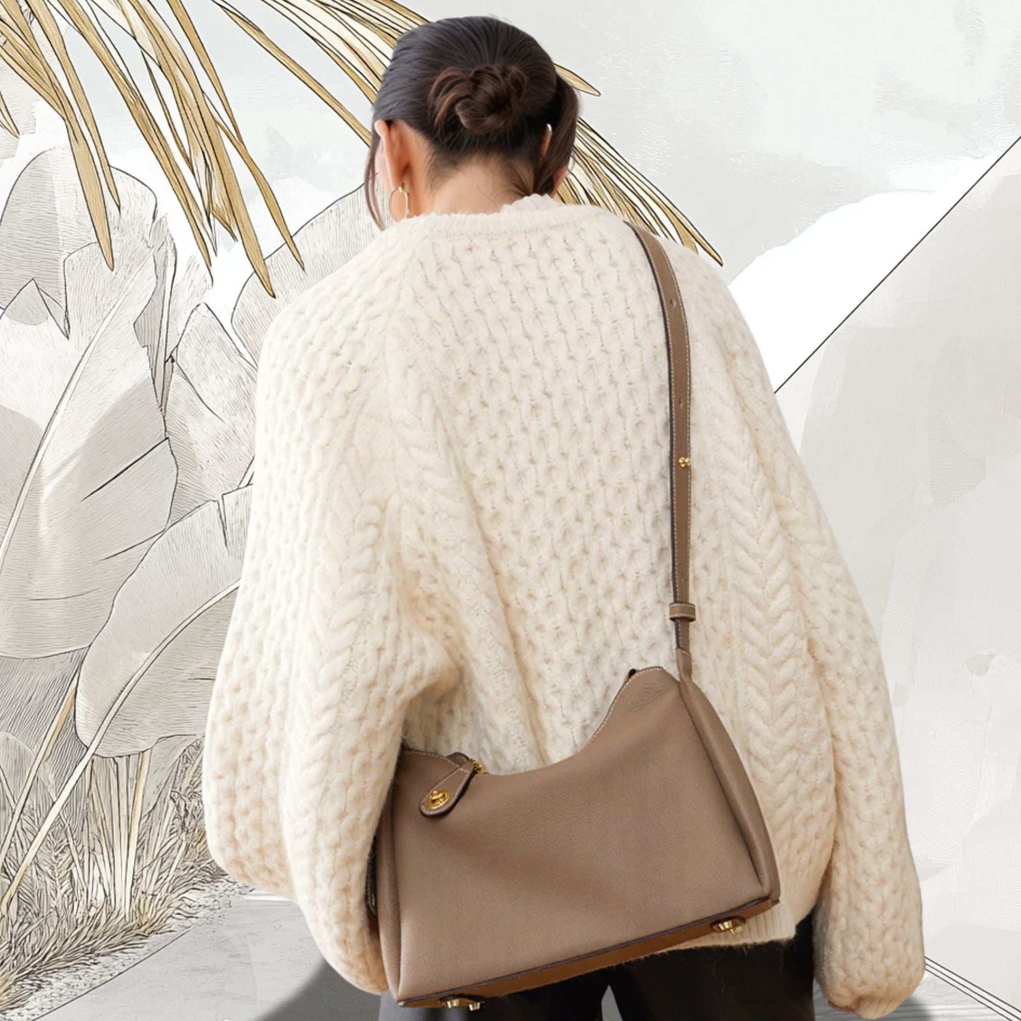 Trapezoid Leather Crossbody Handbag in taupe worn over shoulder, genuine leather, versatile design with