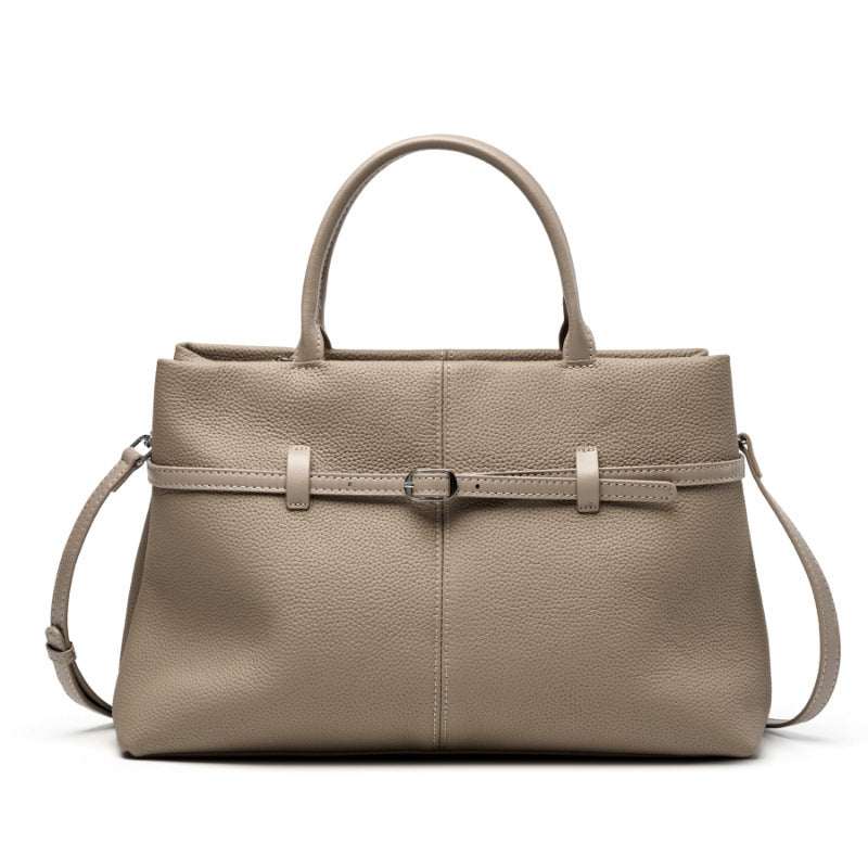 Women's leather briefcase bag in elephant gray with adjustable strap and chic buckle detail.
