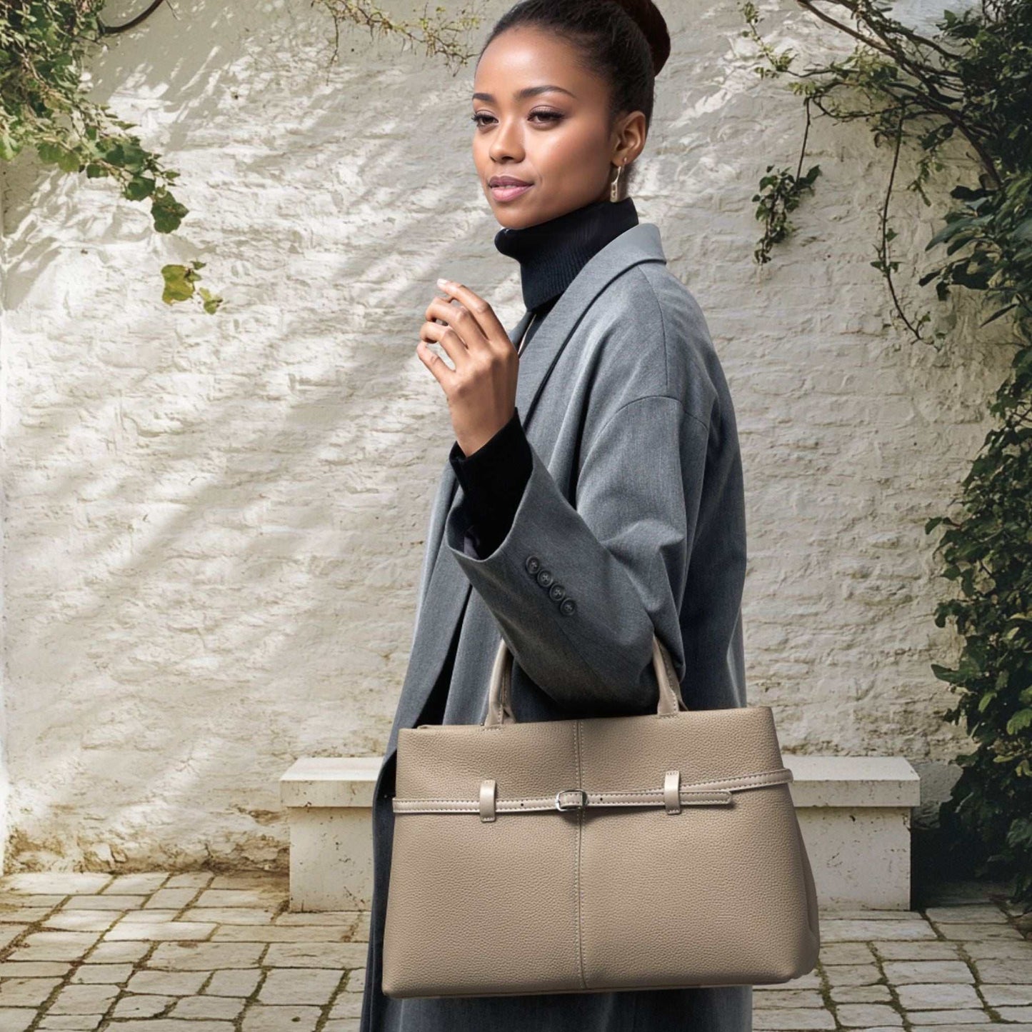 Elegant women's leather briefcase bag with chic buckle detail, versatile for work or brunch.