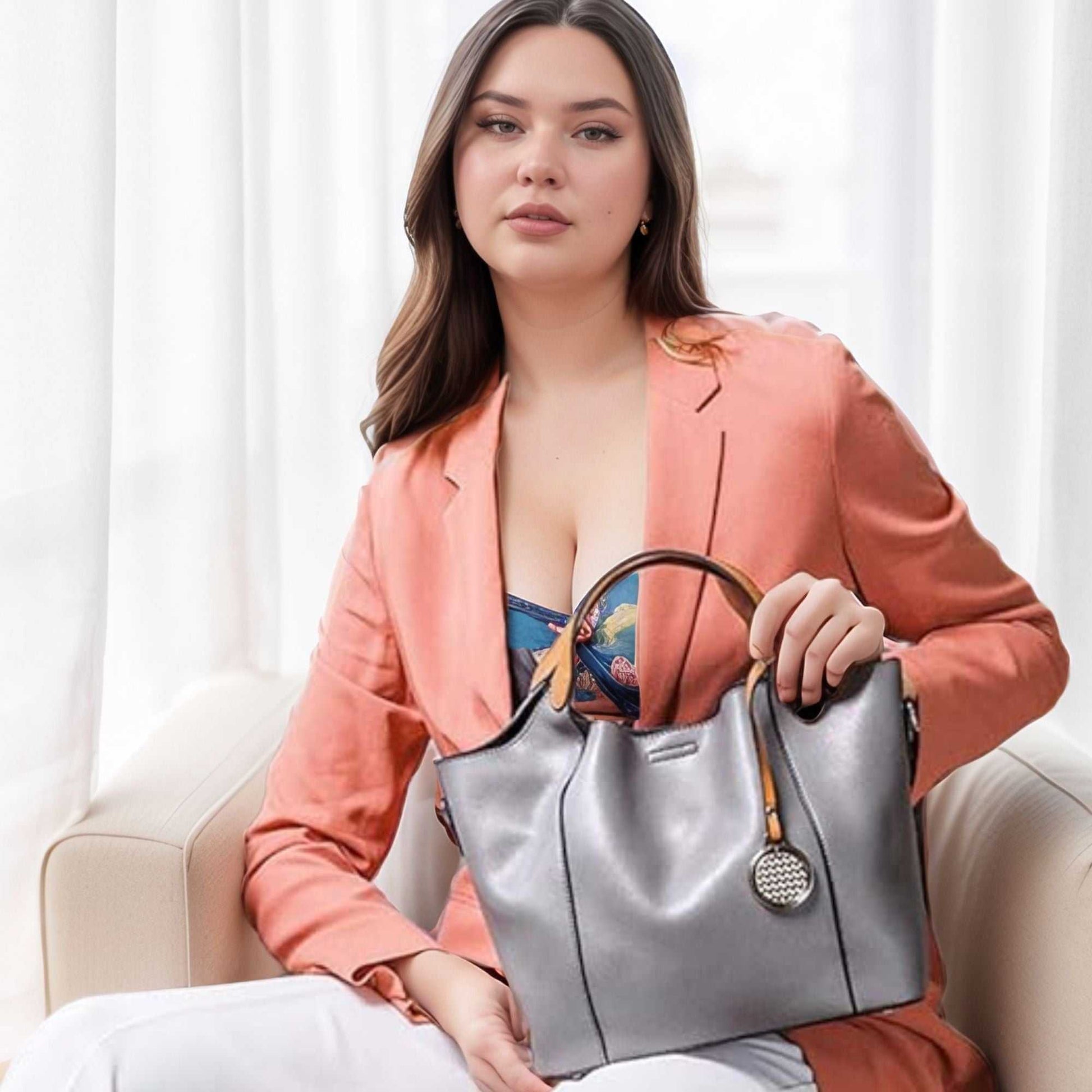 Woman holding a Leather Work Bag from the Essence of Elegance Handbag Collection.