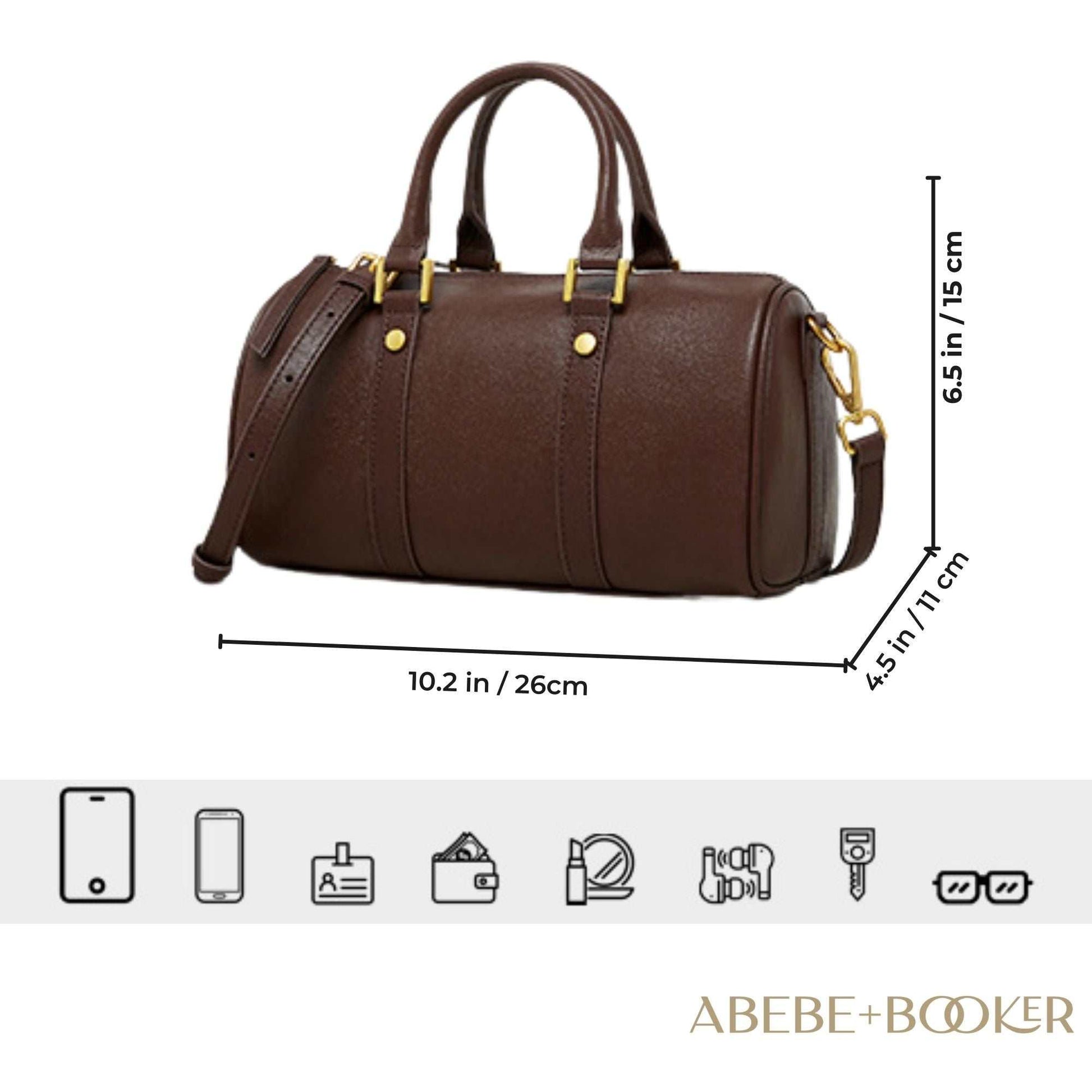 Classic leather barrel handbag with gold hardware, adjustable strap, and multiple pockets for versatile