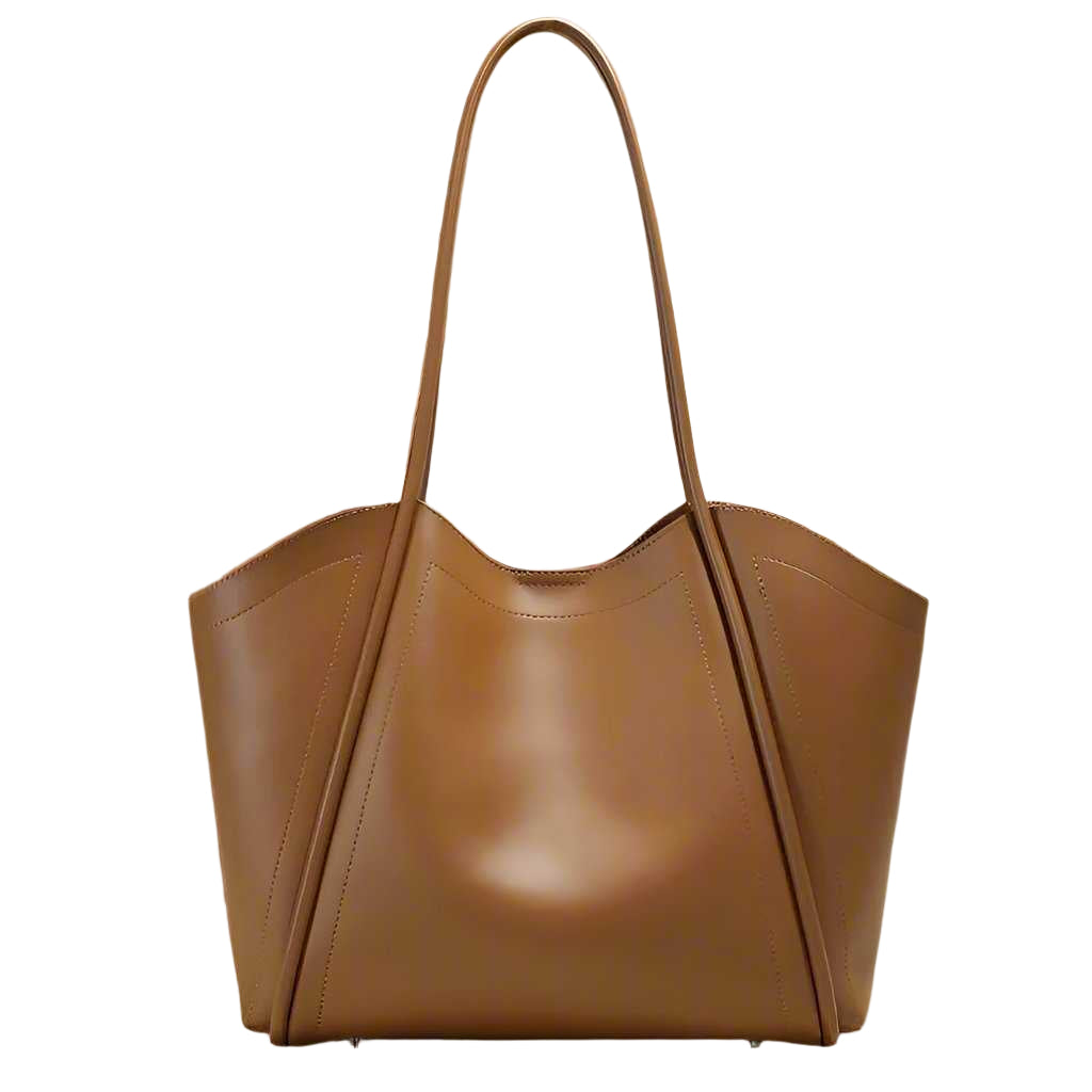 Ladies Leather Tote with elegant, sleek design and rolled leather straps on a neutral background.