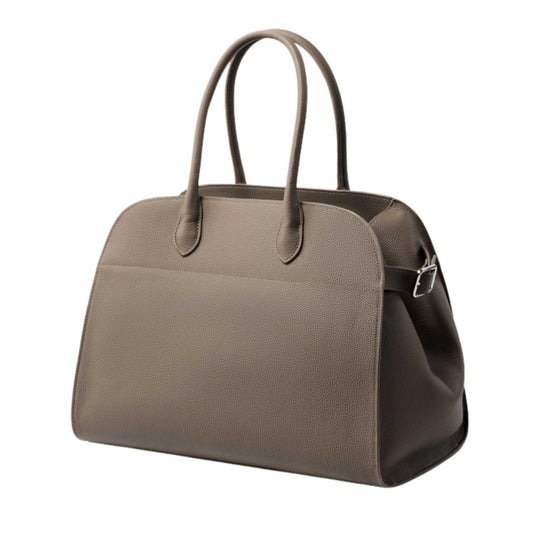Large leather satchel bag with adjustable straps and spacious interior.