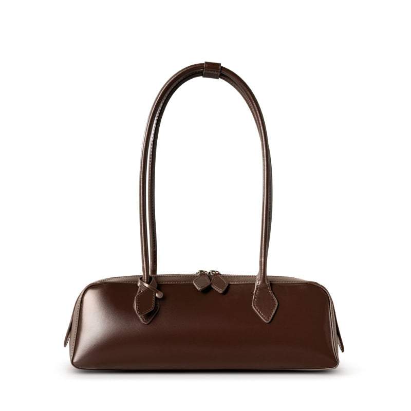 Leather baguette bag with sleek, curved silhouette and rolled