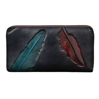 Handcrafted leather womens wallet with embossed leaf design.