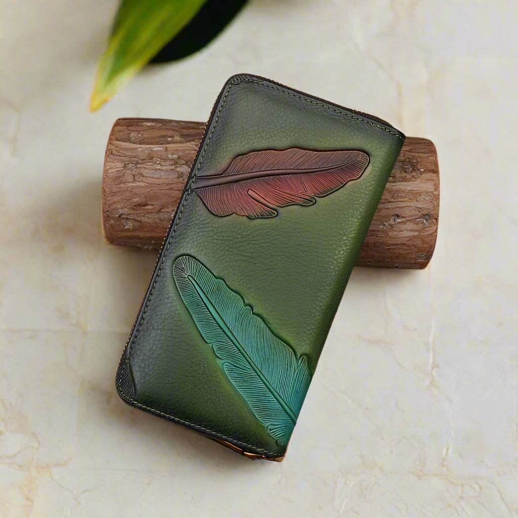 Handcrafted leather womens wallet with embossed leaf design, featuring multiple card slots and compartments