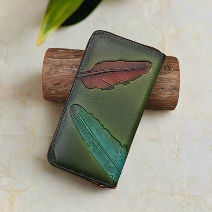 Handcrafted leather womens wallet with embossed leaf design, featuring multiple card slots and compartments