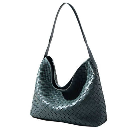 Elegant leather woven bag with wide shoulder strap and slouchy bucket design.