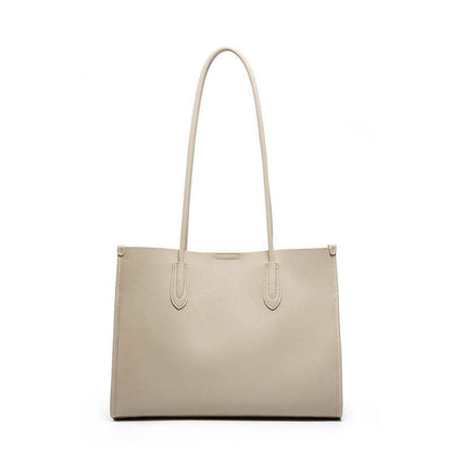 Tote leather bag with long straps, crafted from genuine leather, featuring a minimalist design. Ideal for work,