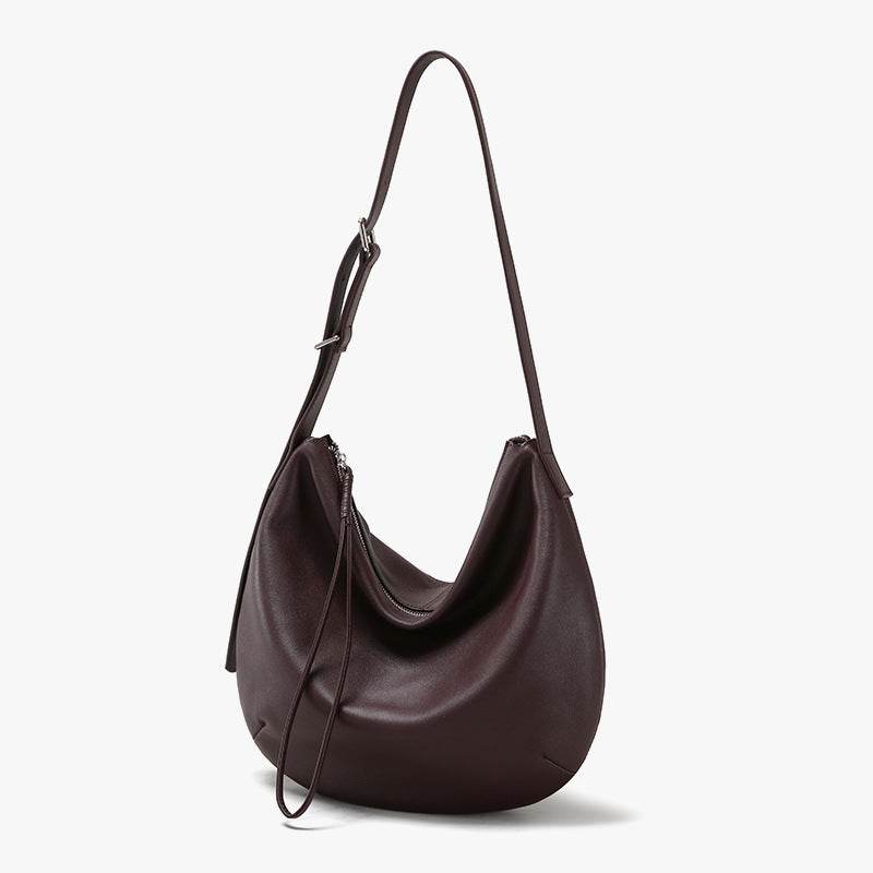 Slouchy Crossbody Bag in genuine leather with adjustable strap.