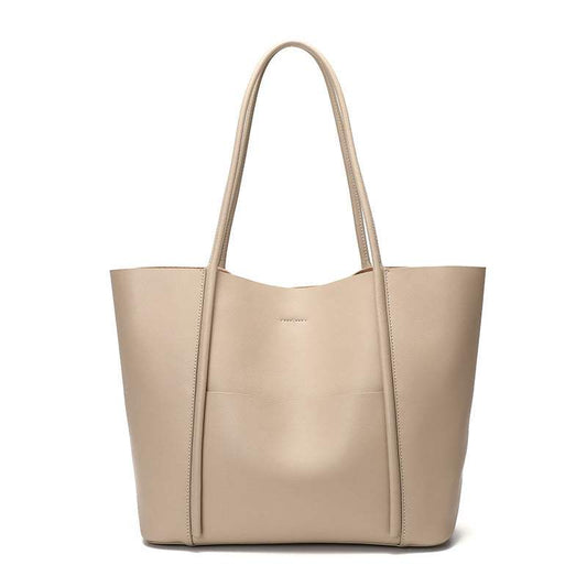 Leather tote bag with rolled handles and exterior pocket, ideal