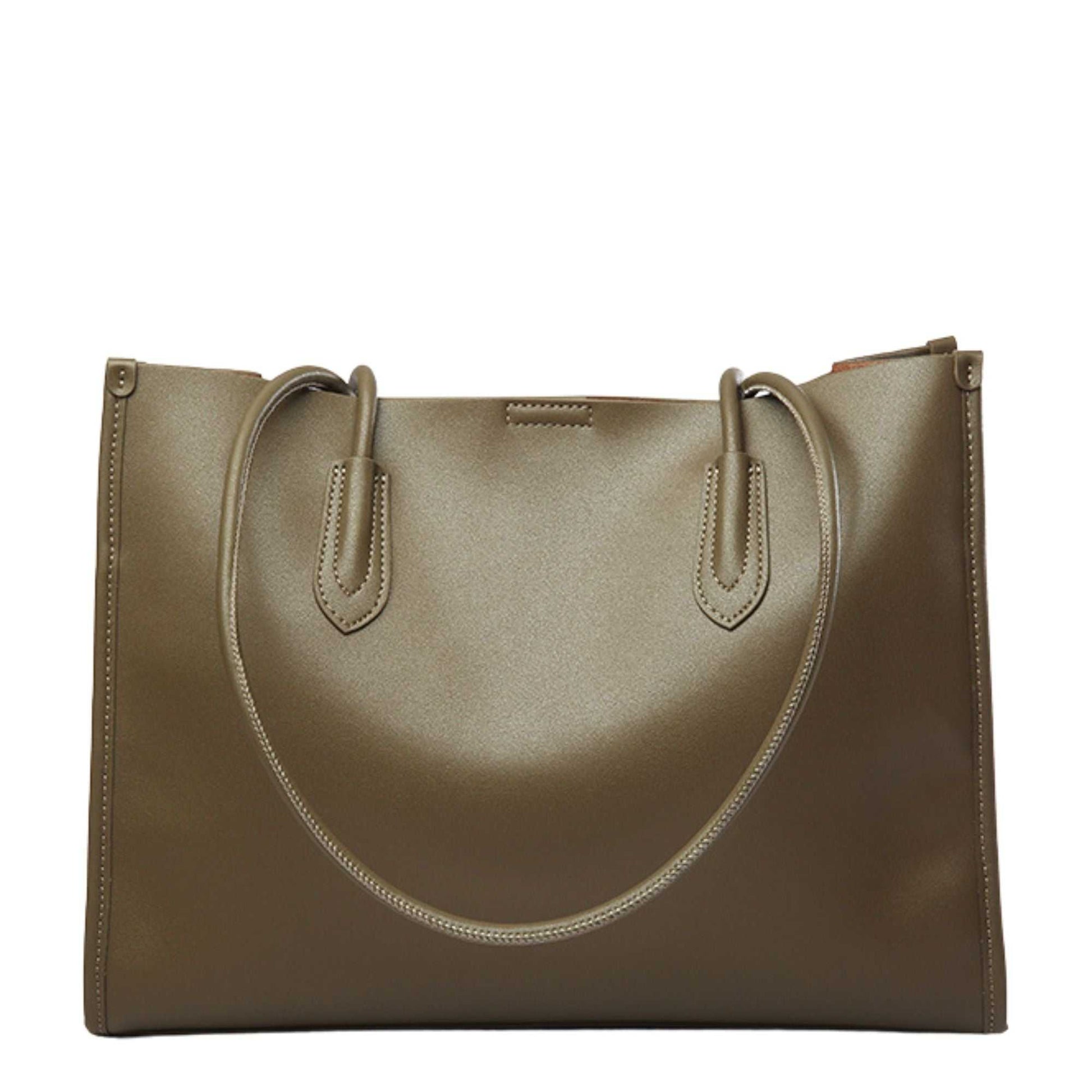 Tote leather bag with durable handles, ideal for versatile use.