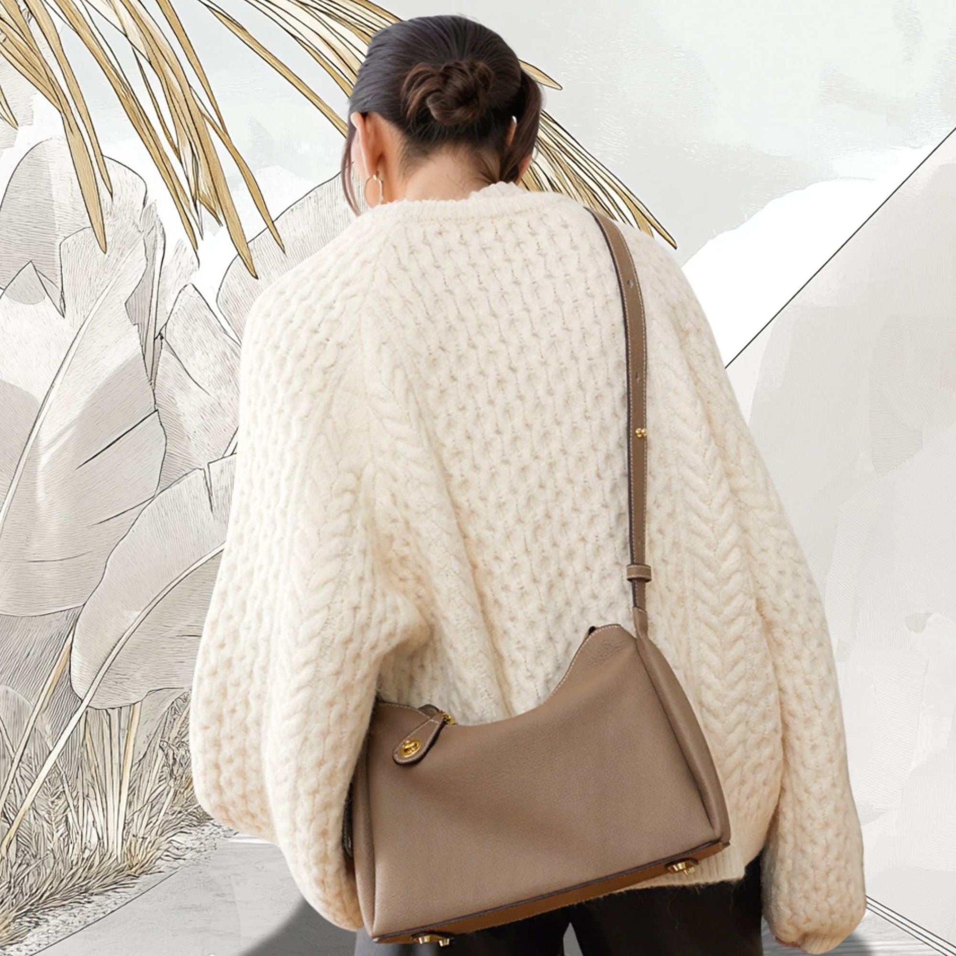 Trapezoid Leather Crossbody Handbag in taupe worn over shoulder, genuine leather, versatile design with