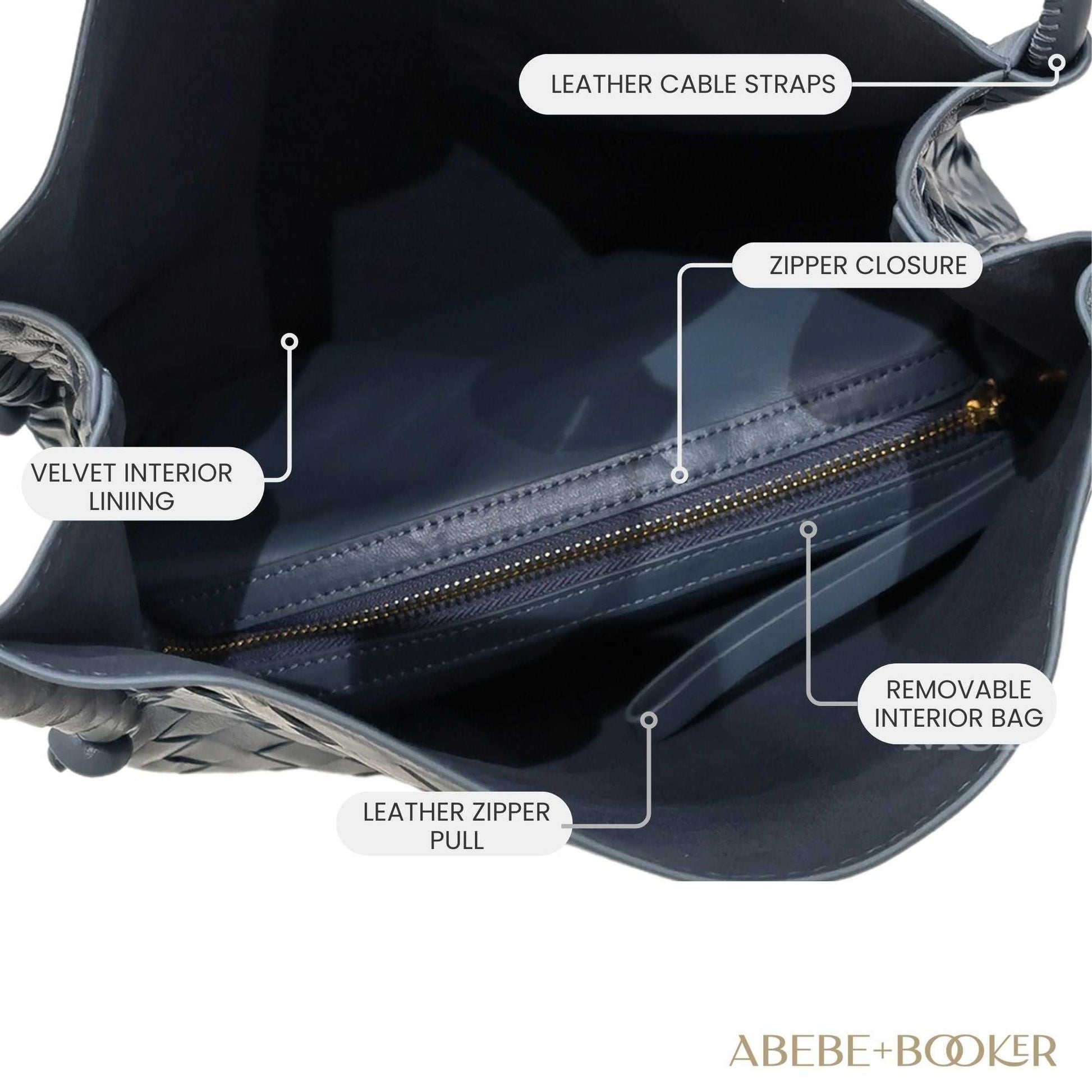 Woven leather tote handbag with spacious interior, leather cable straps, zipper closure,