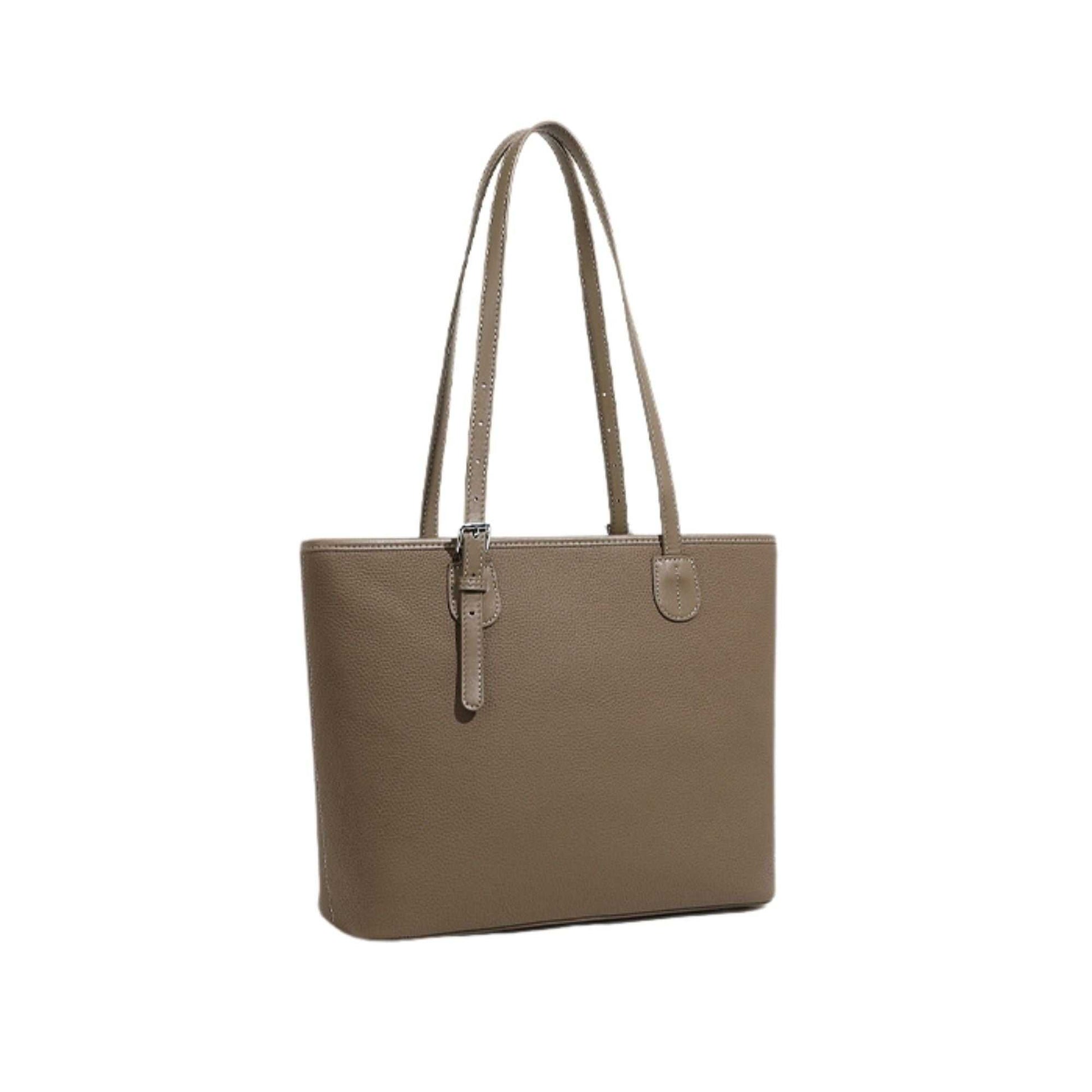 Leather zip tote bag with long handles, shown in a neutral tone.