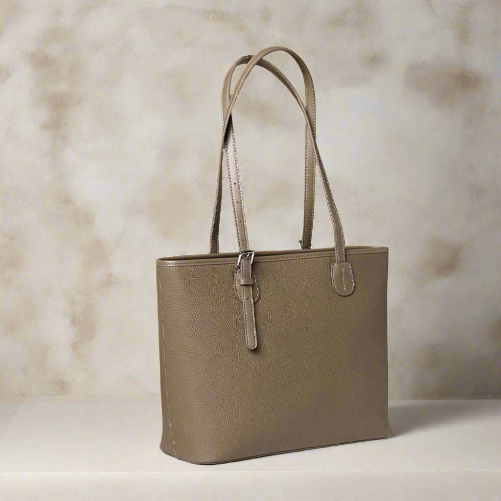 Zip Tote Bag Leather with adjustable straps and two-tone design.