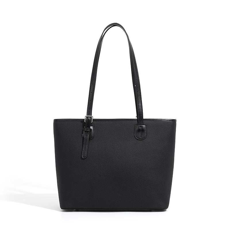 Black leather zip tote bag with adjustable shoulder straps, classic and spacious design.