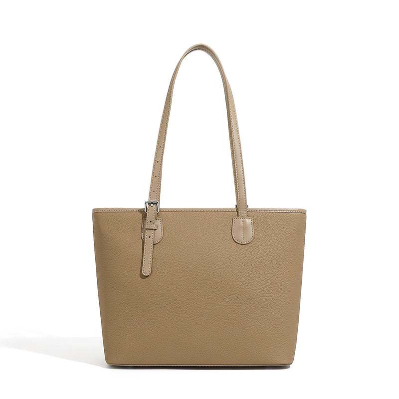 Leather zip tote bag with adjustable straps and spacious compartments.