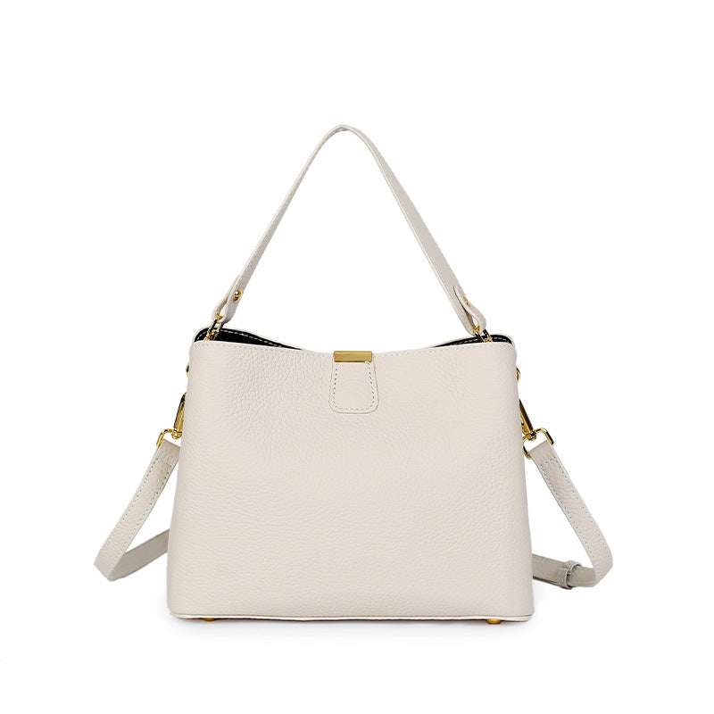Leather small crossbody purse with adjustable straps and genuine leather texture.