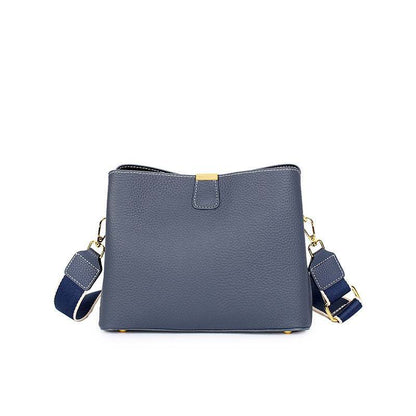 Genuine leather small crossbody purse with adjustable straps and versatile design.