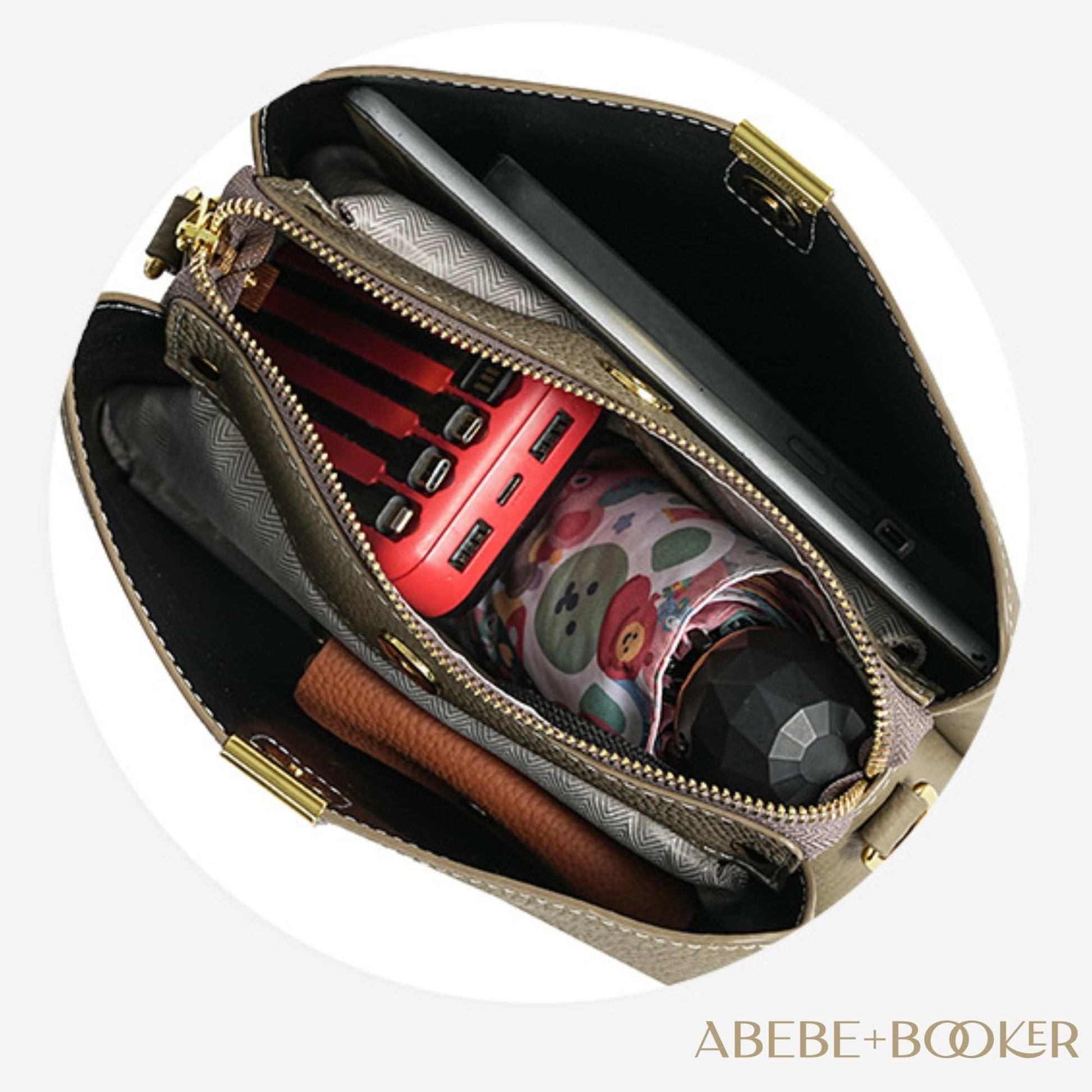 Leather small crossbody purse with zippered interior and exterior pockets, showcasing ample storage for essentials.