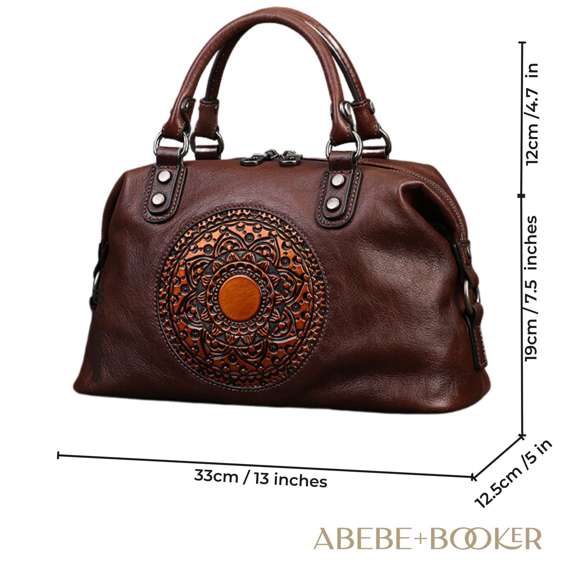 Genuine leather retro bag with vintage embossed medallion design and double zippers, showcasing classic elegance and modern functionality.
