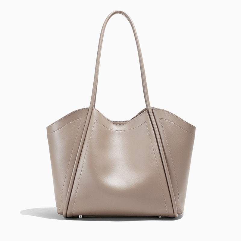 Ladies Leather Tote in genuine leather with sleek design and spacious interior.